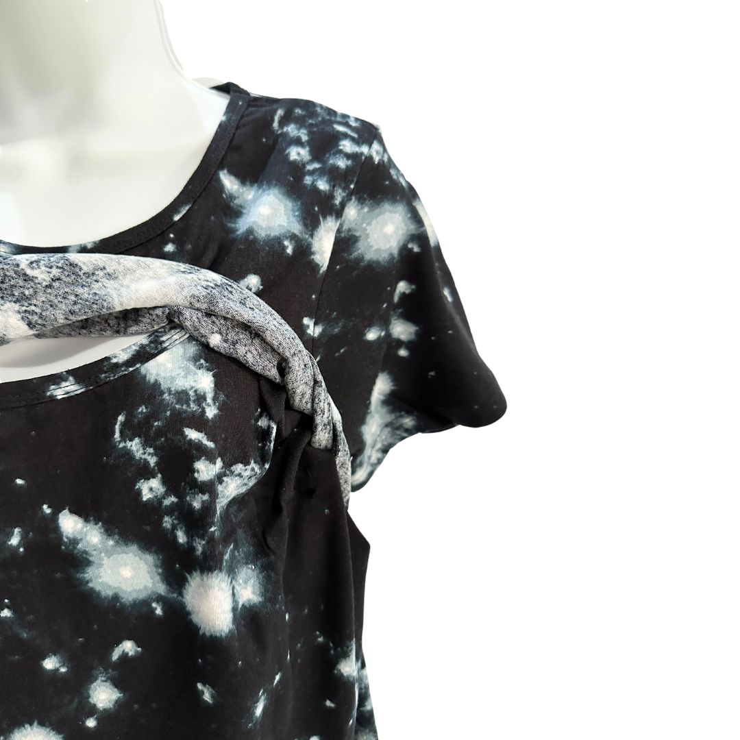 Black and white galaxy themed short sleeve womans nursing and pumping top. Front flap open to showcase easy access for breastfeeding and pumping.