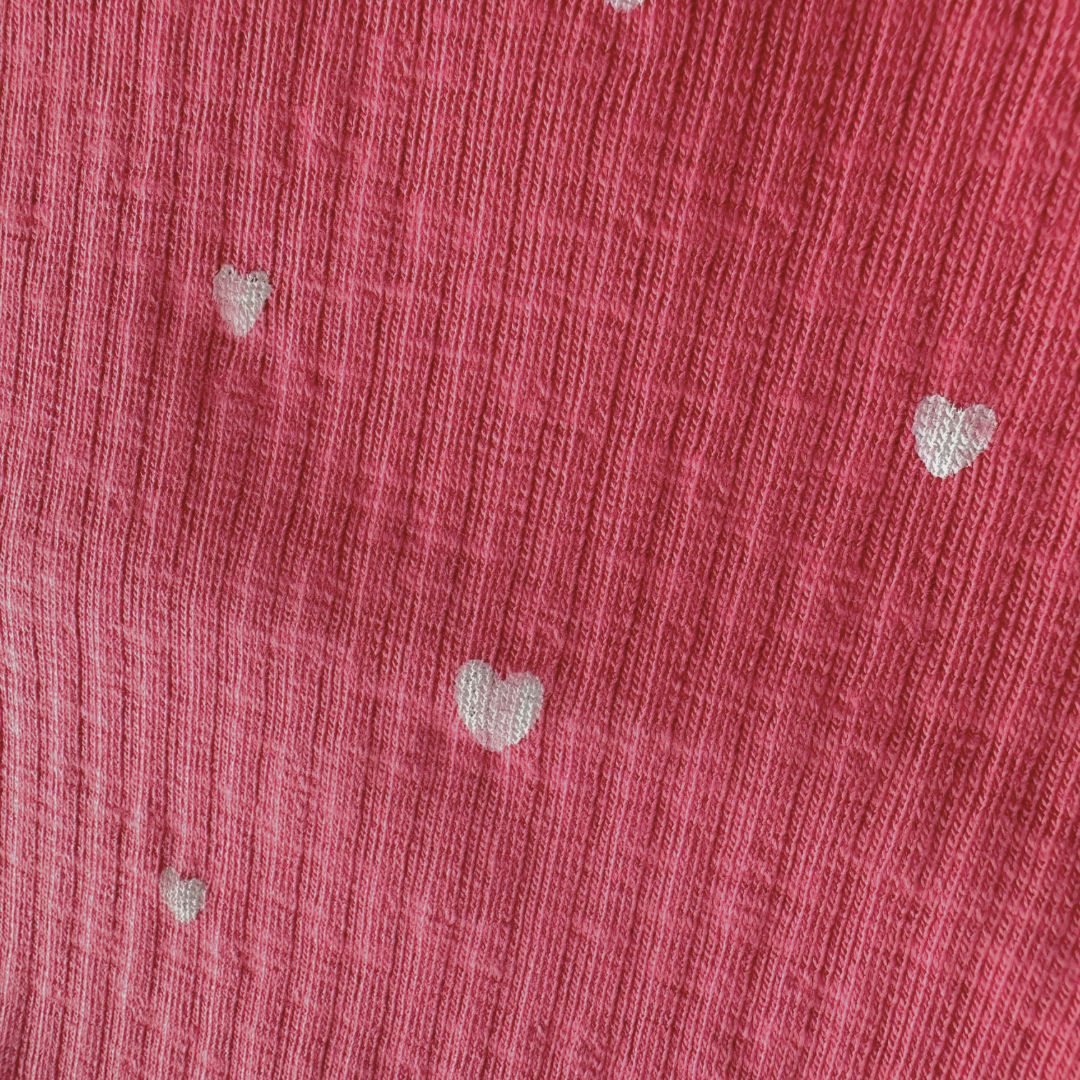 Pink with small white hearts, ribbed material pattern