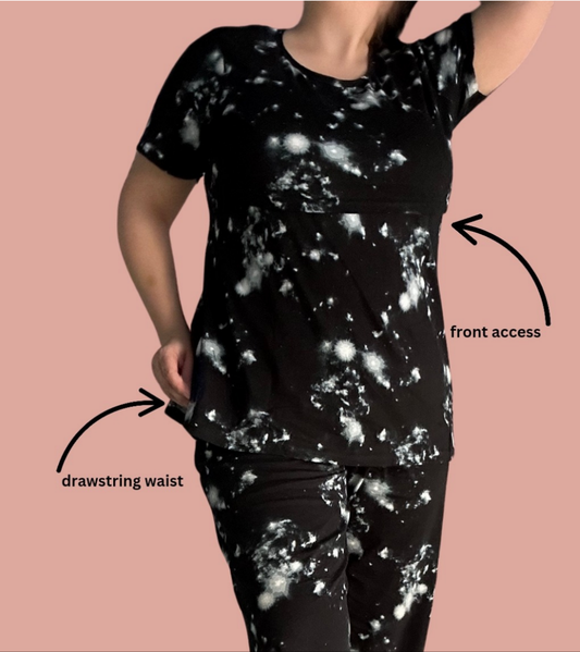 Black and white Galaxy themed short sleeve and long pants maternity and Postpartum Lounge Set. Showcasing front panel access lifts for easy and discreet breastfeeding and pumping. Relaxed pant with drawstring waist.