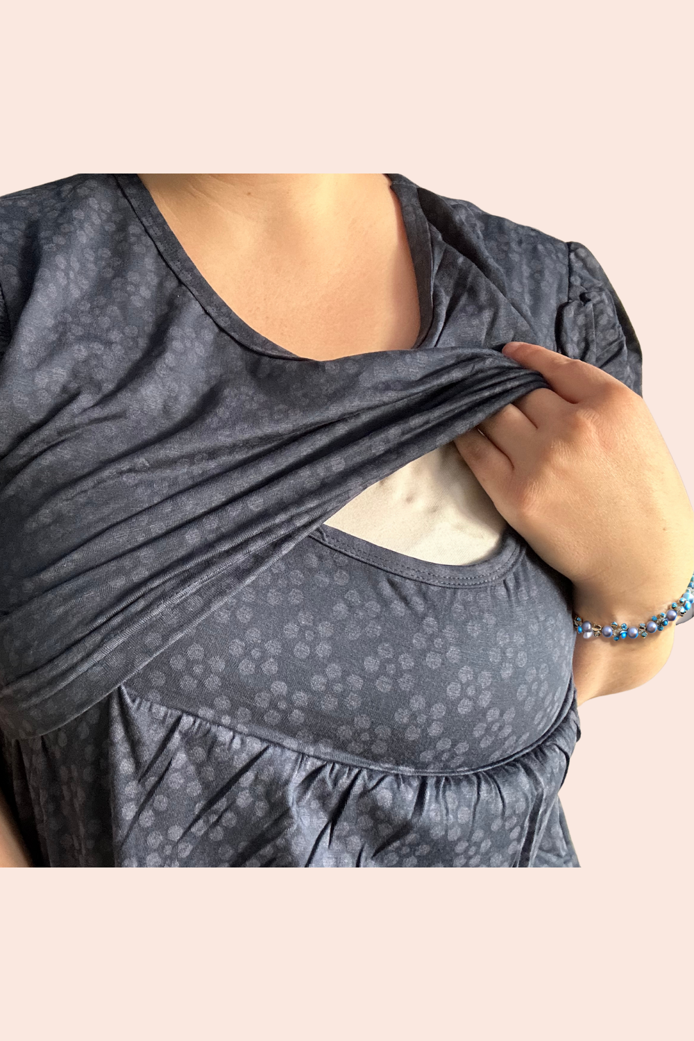 Showcasing the front panel lifted for easy and discreet access for breastfeeding and pumping